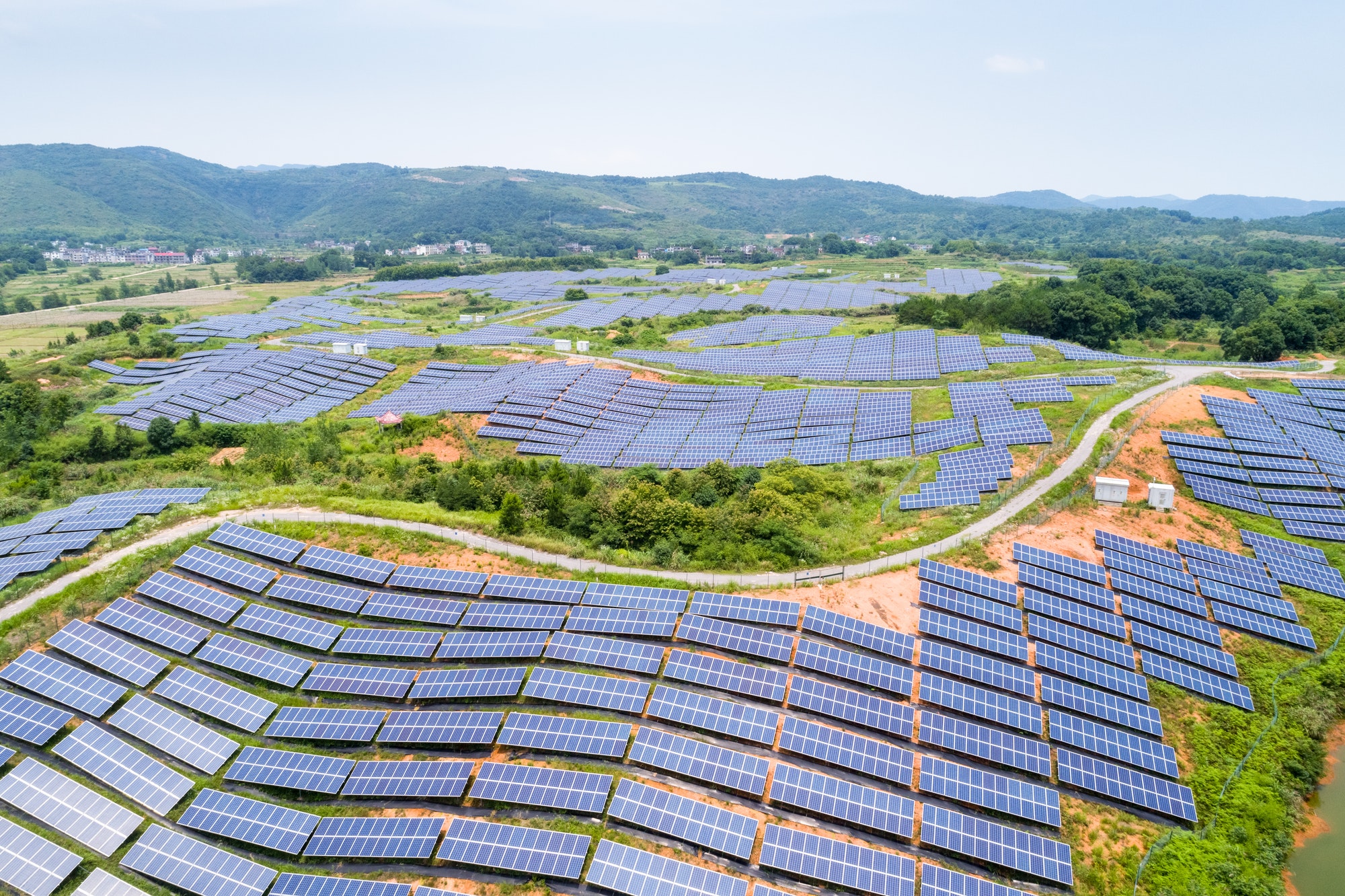 solar-power-station-on-hillside-aerial-view-of-renewable-energy.jpg